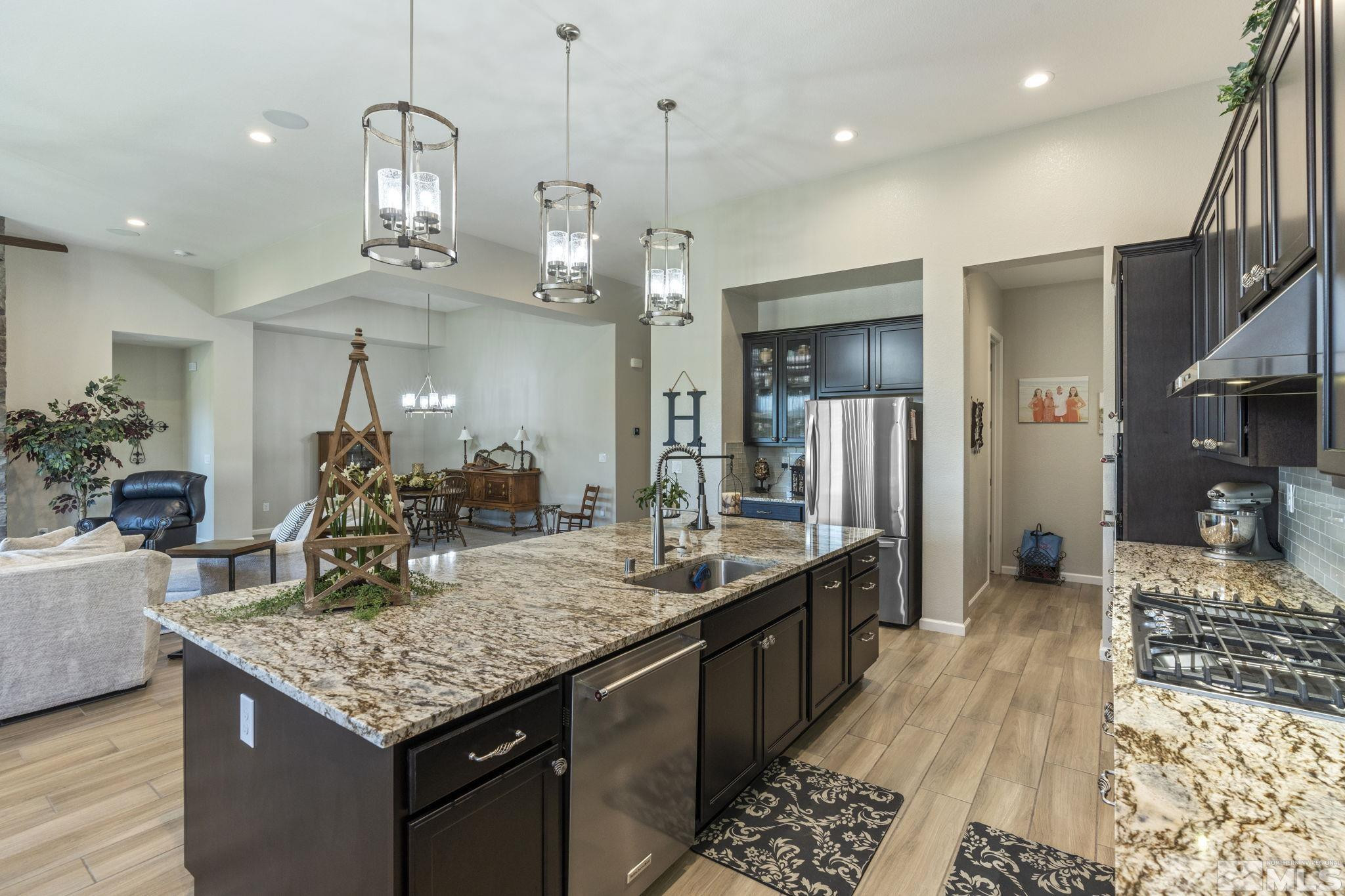 2420 Buttermere Court Reno, NV 89521 - Photo 13 of 40 a kitchen with center island table and chairs