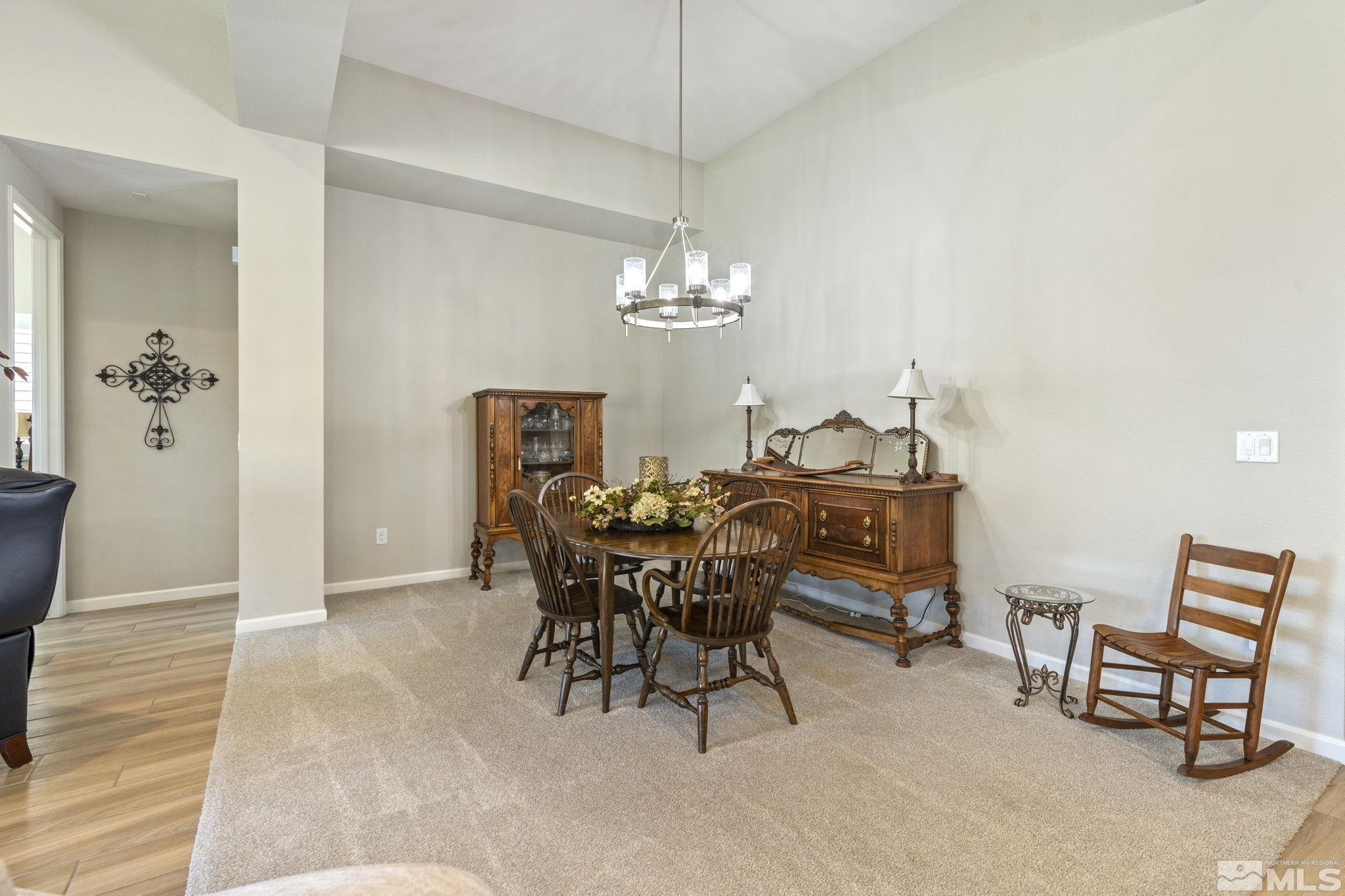 2420 Buttermere Court Reno, NV 89521 - Photo 18 of 40 a view of a dining room with furniture and chandelier