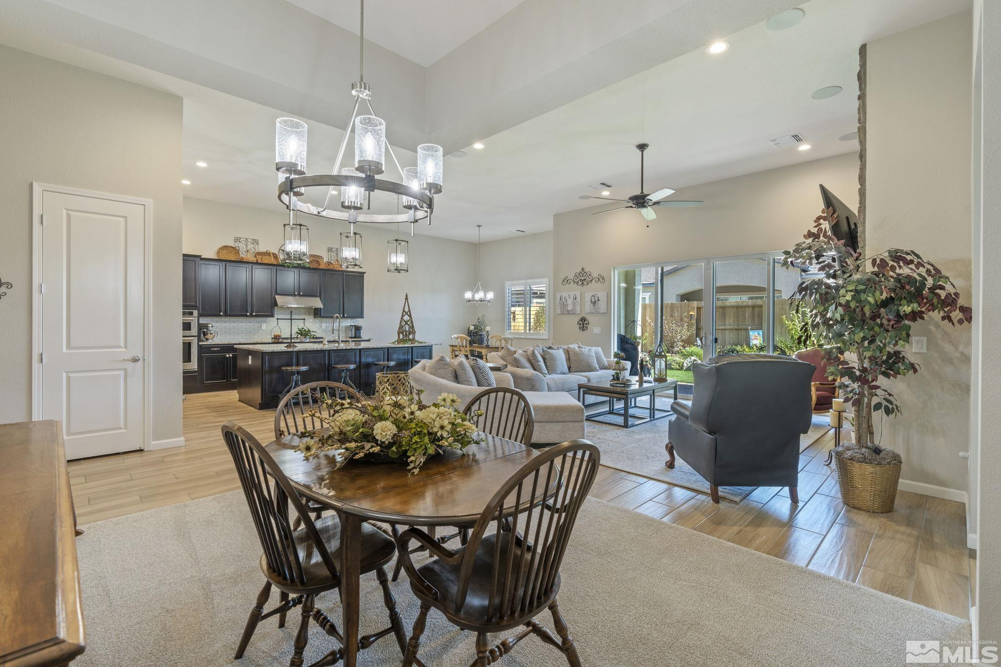 2420 Buttermere Court Reno, NV 89521 - Photo 19 of 40 a view of a dining room with furniture and chandelier