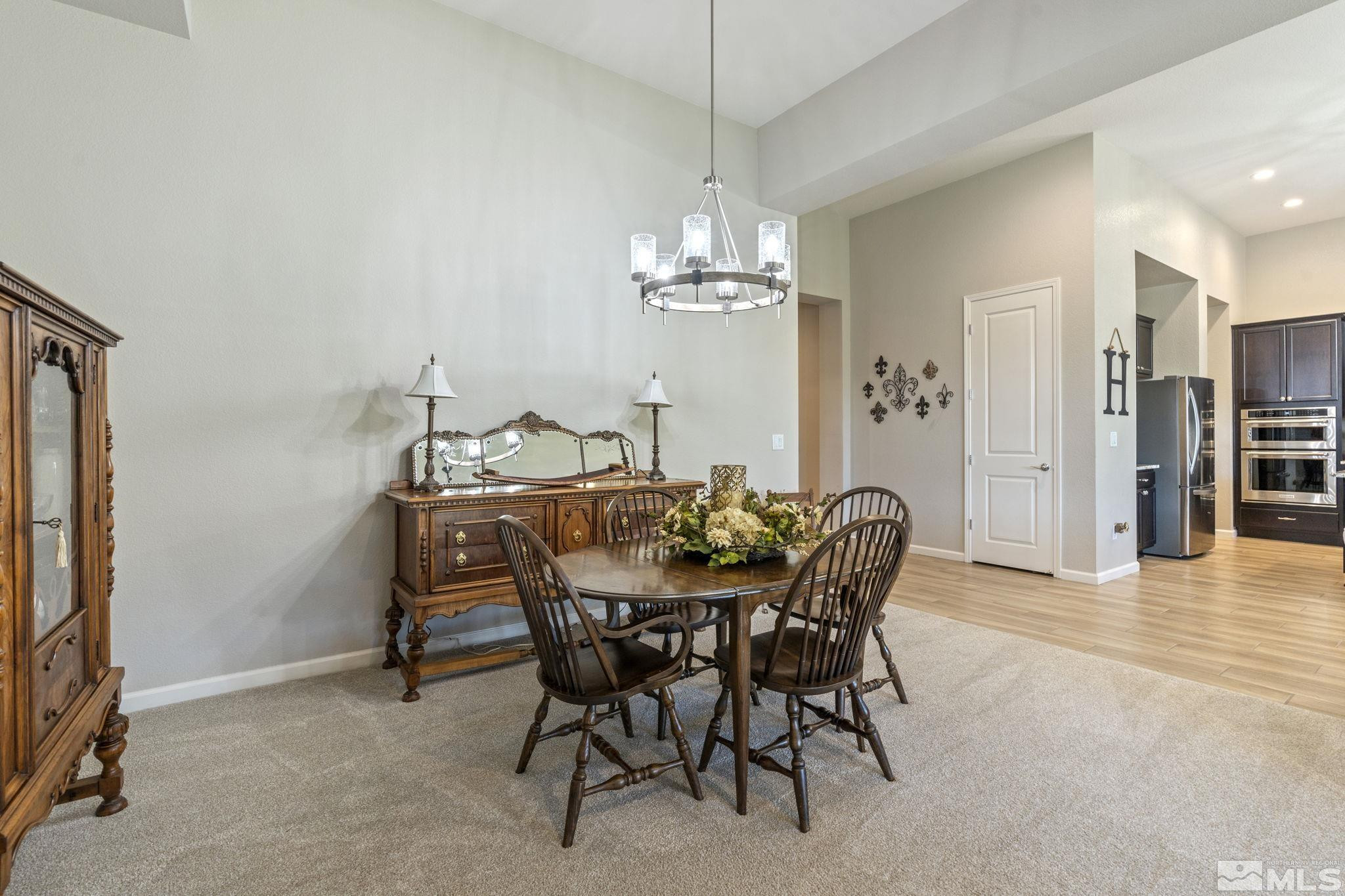 2420 Buttermere Court Reno, NV 89521 - Photo 20 of 40 a dining room with furniture a chandelier and window