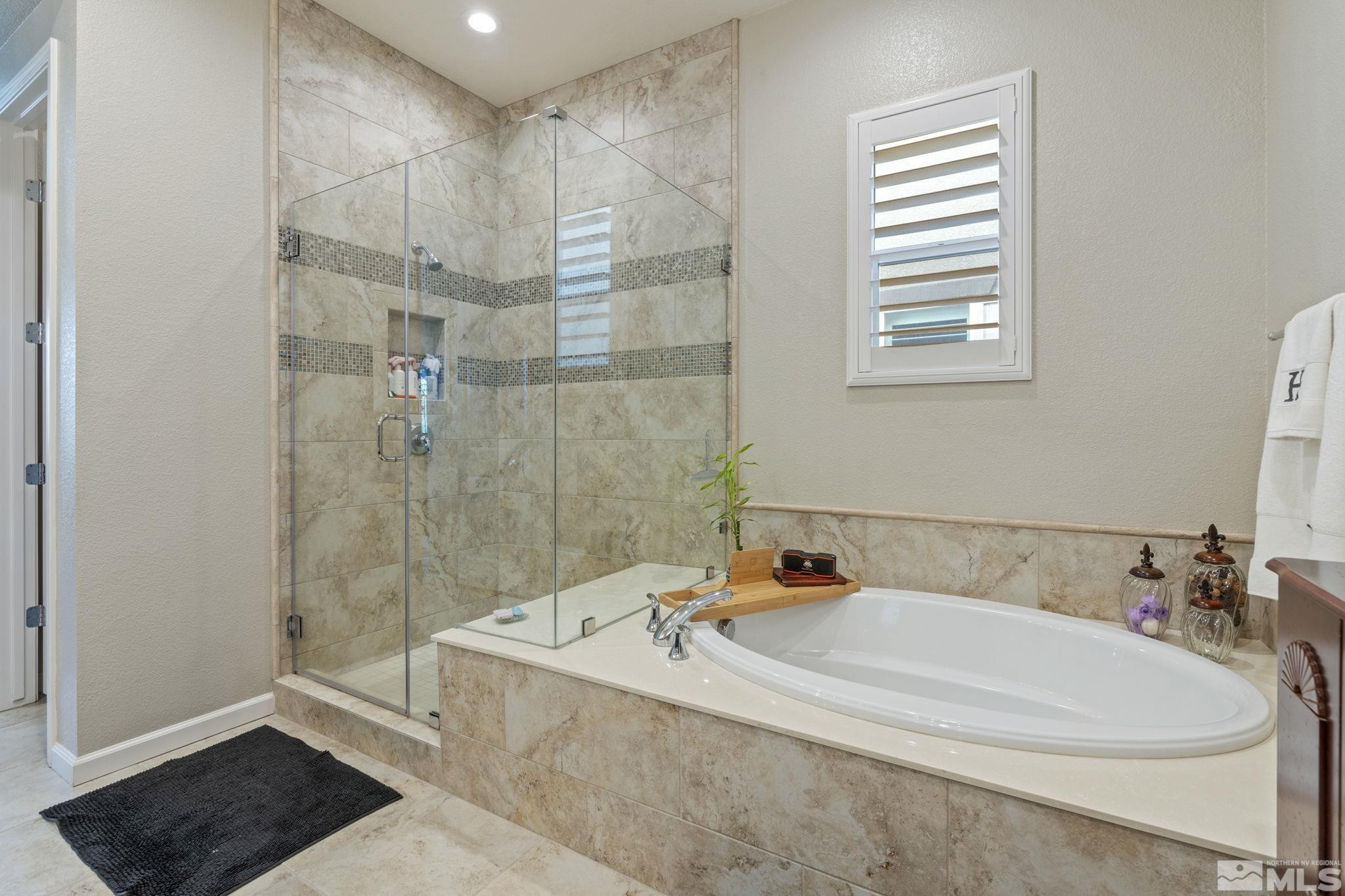 2420 Buttermere Court Reno, NV 89521 - Photo 25 of 40 a bathroom with a tub sink and shower