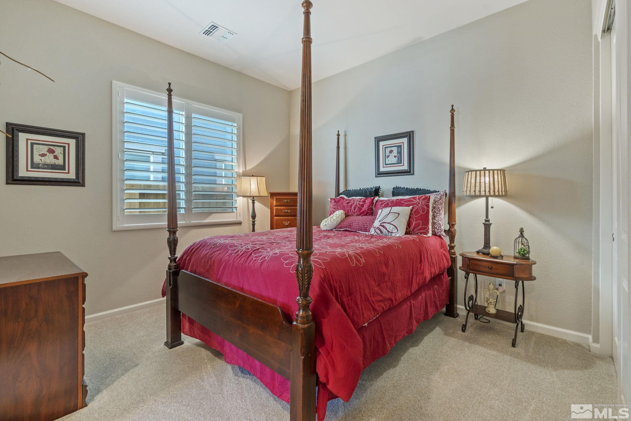 2420 Buttermere Court Reno, NV 89521 - Photo 26 of 40 a bedroom with a bed and a table in it