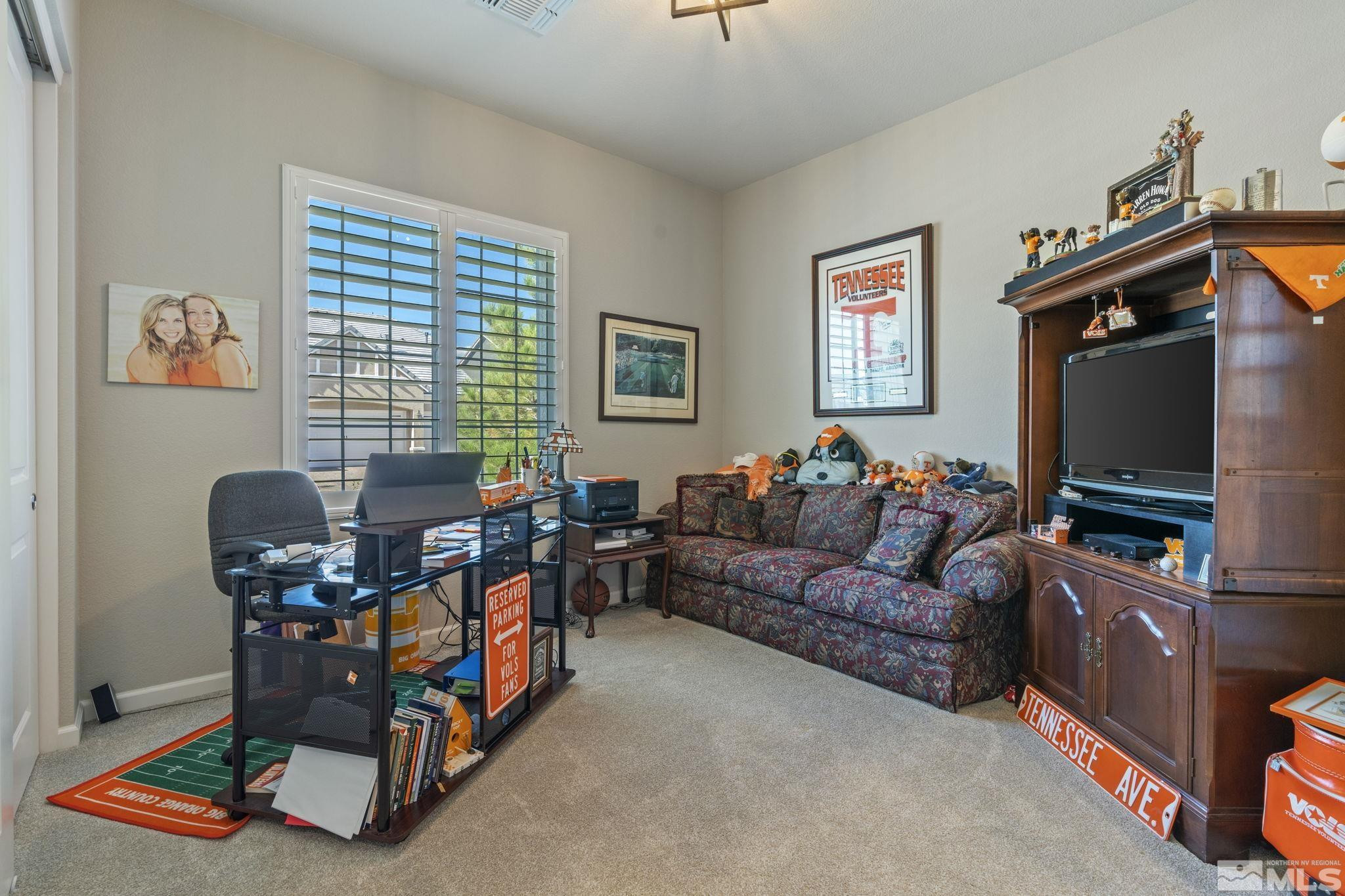 2420 Buttermere Court Reno, NV 89521 - Photo 27 of 40 a living room with furniture and a flat screen tv