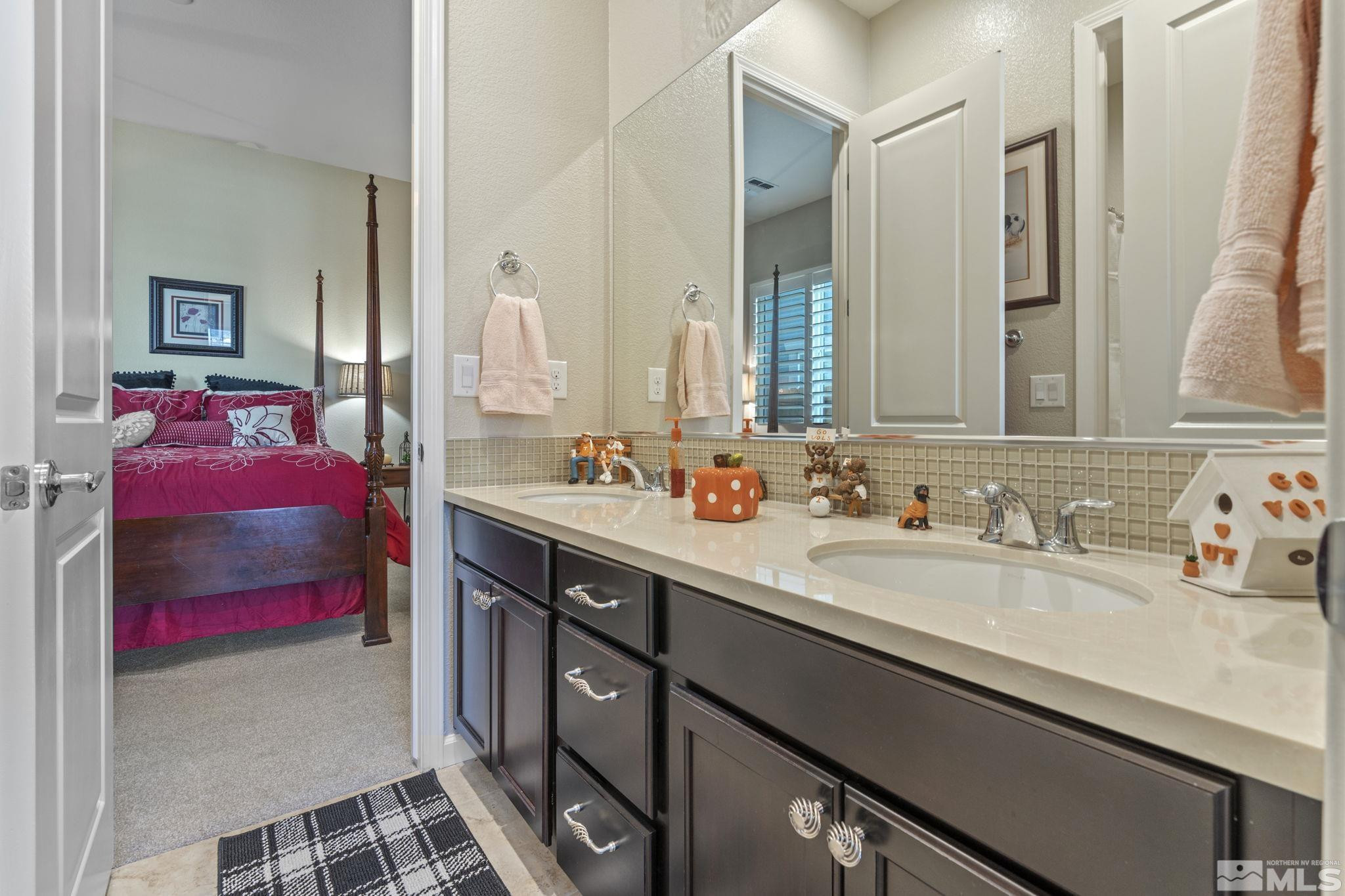 2420 Buttermere Court Reno, NV 89521 - Photo 28 of 40 a spacious bathroom with a sink double vanity and a mirror