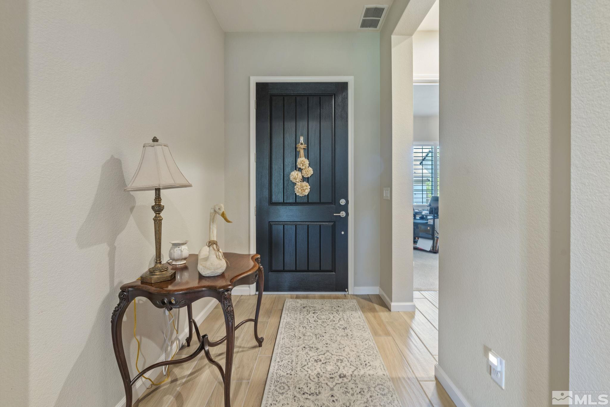 2420 Buttermere Court Reno, NV 89521 - Photo 3 of 40 a view of an entryway with wooden floor