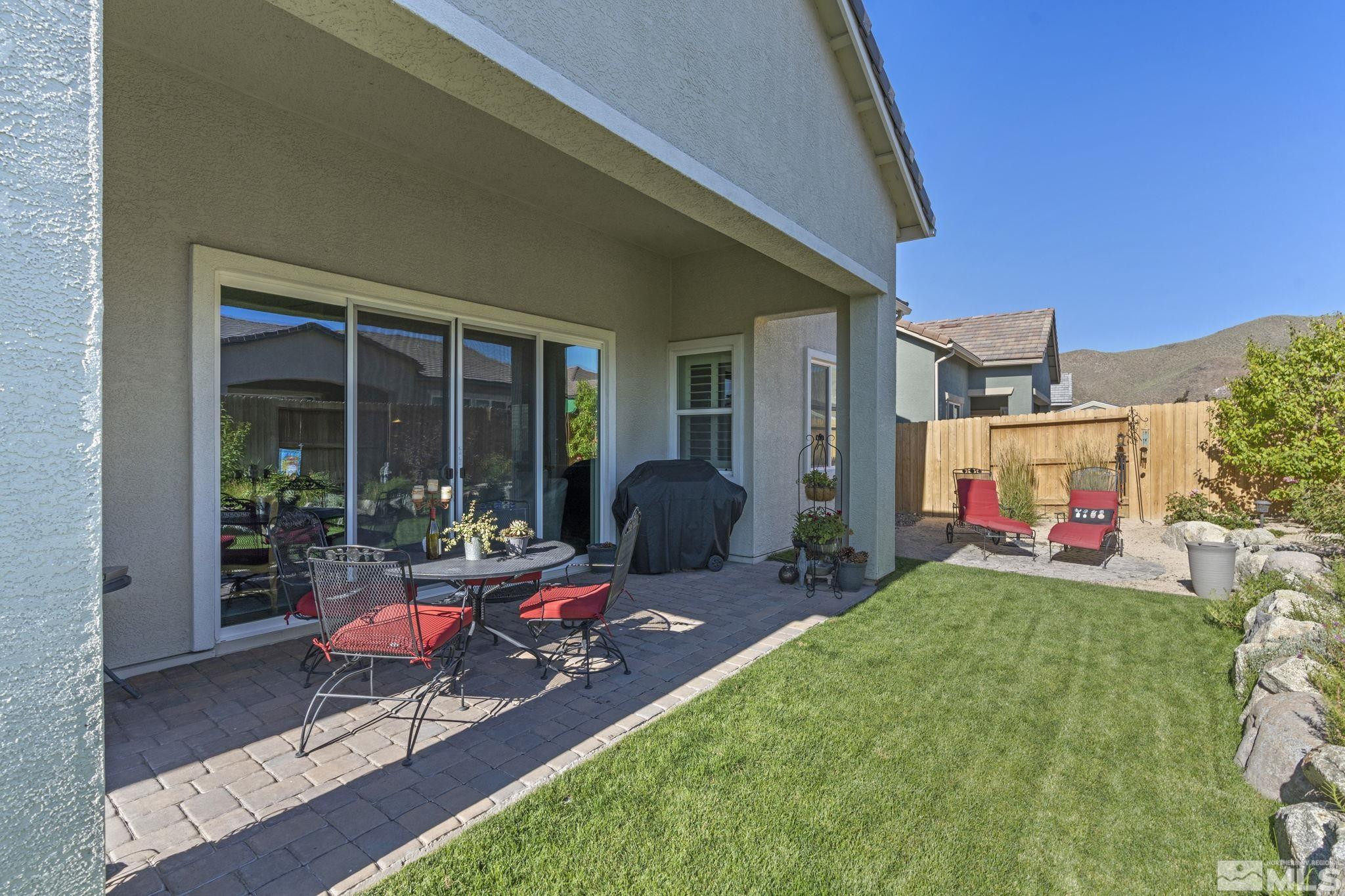 2420 Buttermere Court Reno, NV 89521 - Photo 32 of 40 a building outdoor space with patio furniture and potted plants