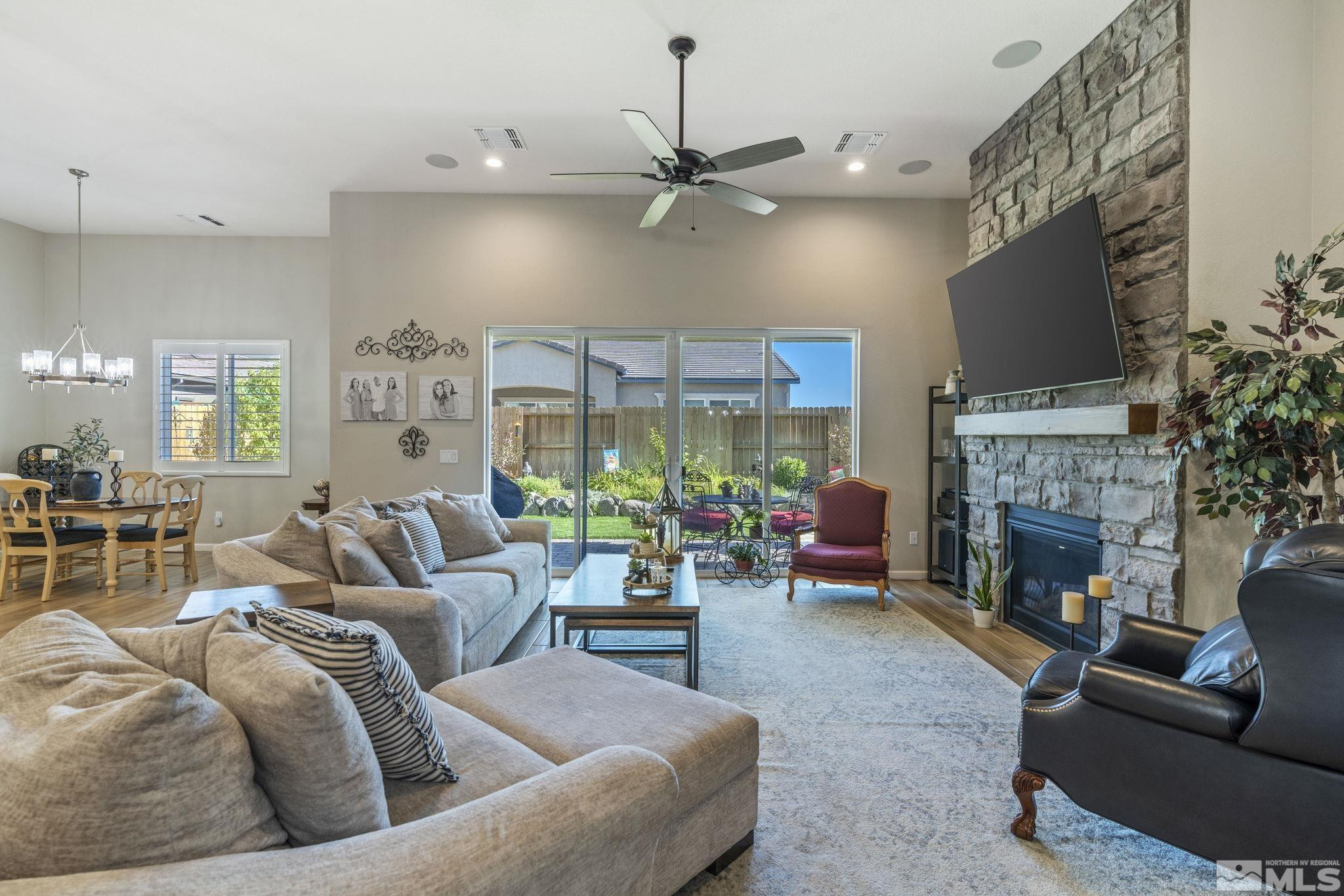 2420 Buttermere Court Reno, NV 89521 - Photo 5 of 40 a living room with furniture fireplace and a flat screen tv