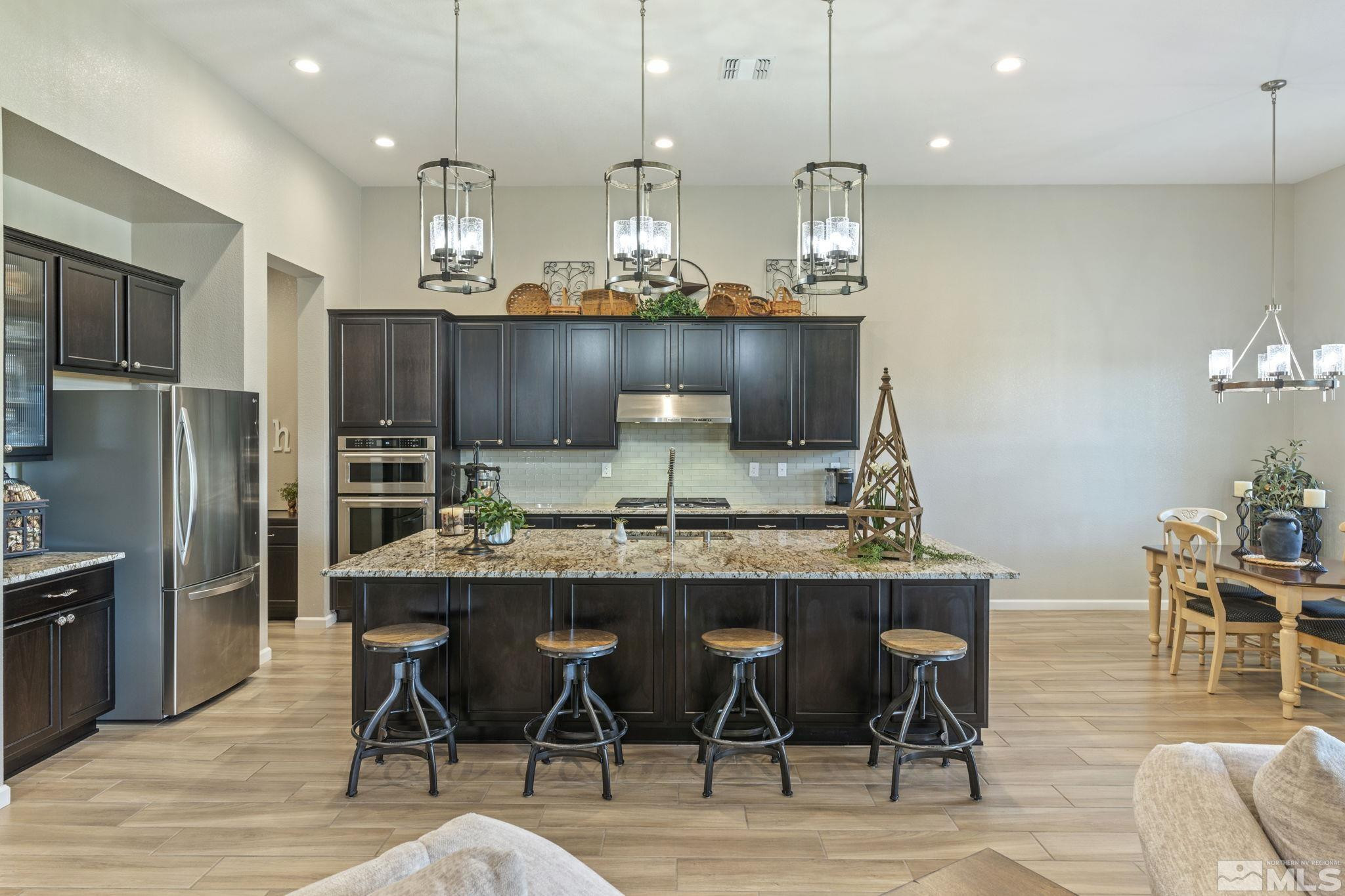 2420 Buttermere Court Reno, NV 89521 - Photo 10 of 40 a kitchen with a table and chairs in it