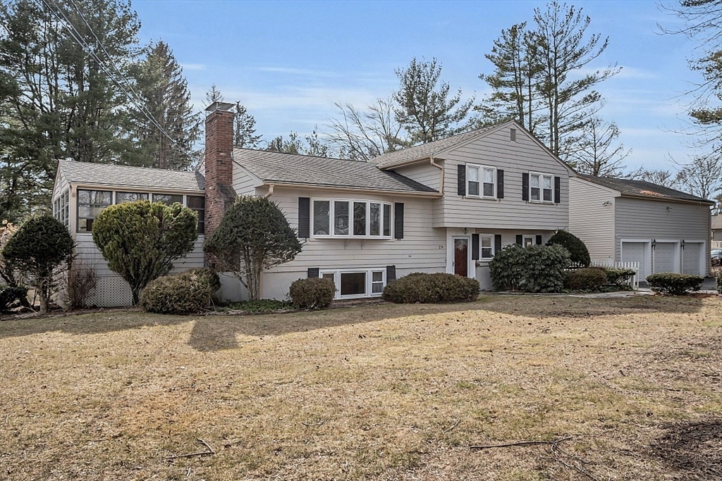 29 Meriam Road Concord, MA 01742 - Photo 1 of 24 a view of a house with a yard covered in snow