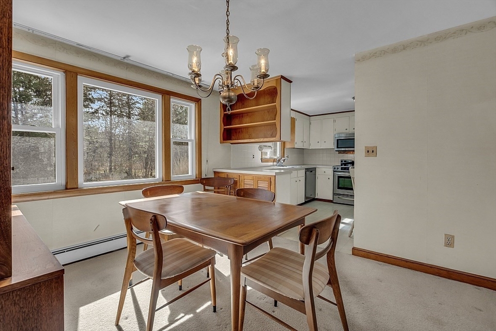 29 Meriam Road Concord, MA 01742 - Photo 11 of 24 a view of a dining room with furniture window and wooden floor