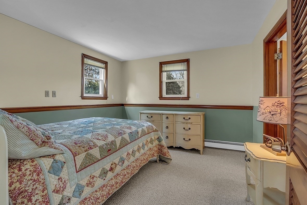 29 Meriam Road Concord, MA 01742 - Photo 13 of 24 a bedroom with a bed and a dresser