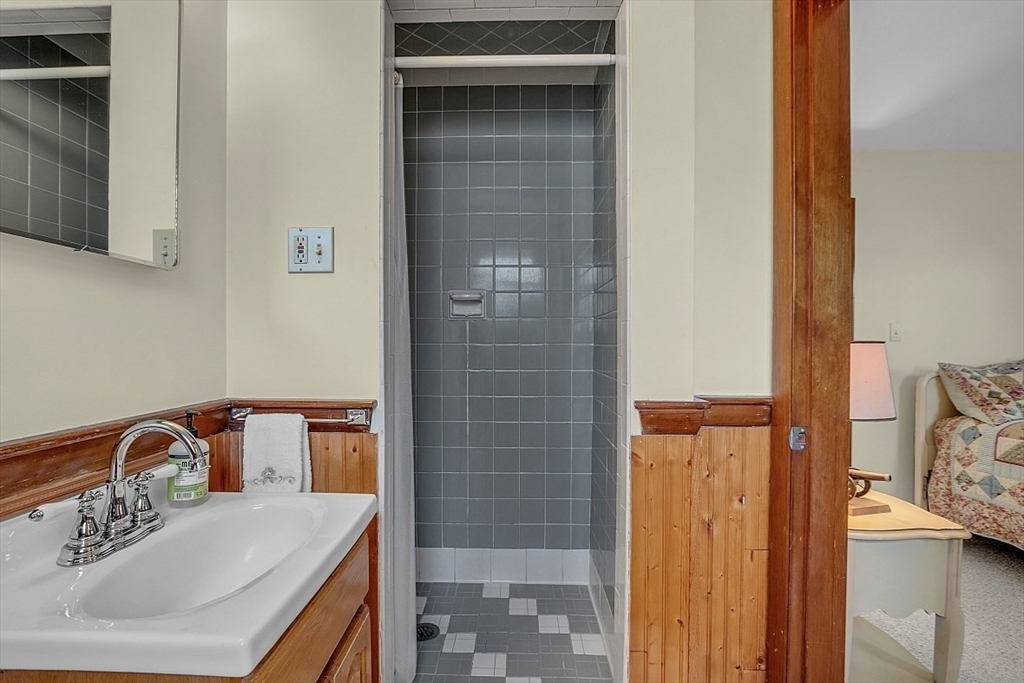 29 Meriam Road Concord, MA 01742 - Photo 16 of 24 a bathroom with a sink and a mirror