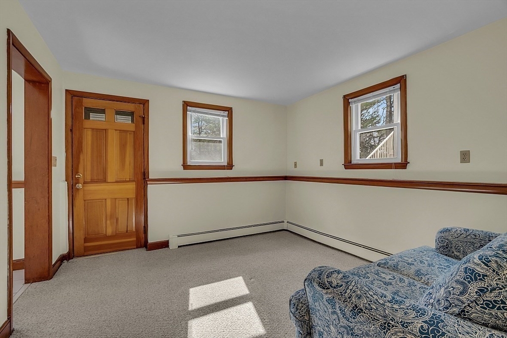 29 Meriam Road Concord, MA 01742 - Photo 17 of 24 a bedroom with a bed and a window