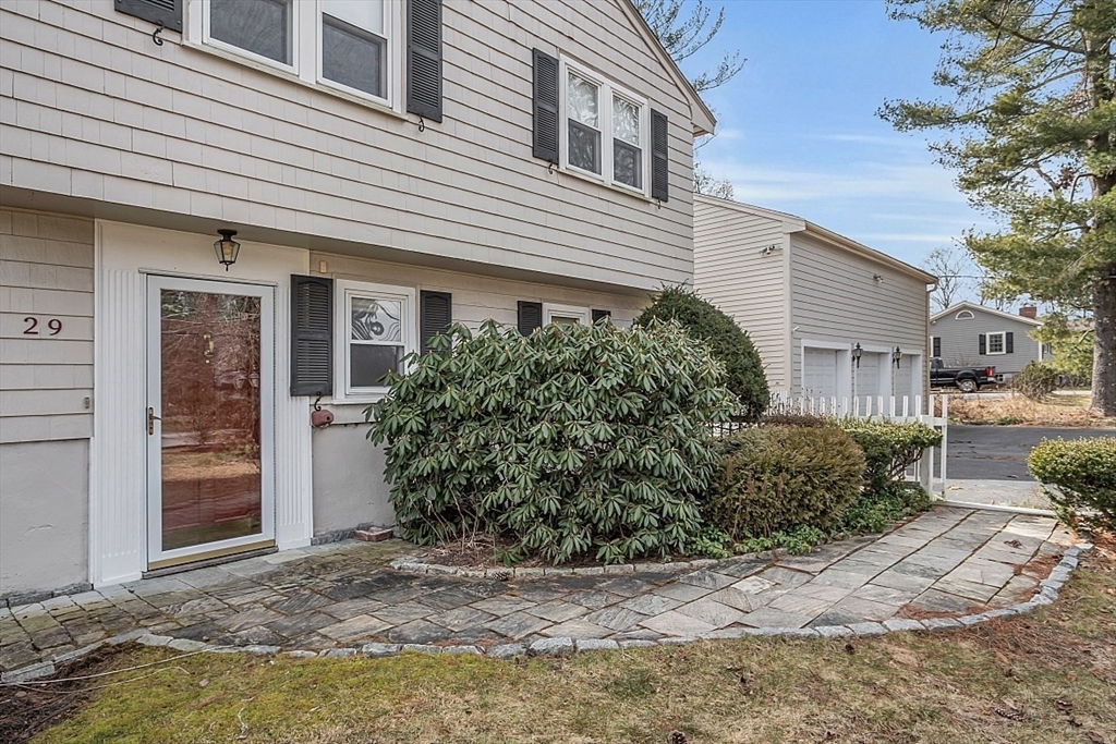 29 Meriam Road Concord, MA 01742 - Photo 2 of 24 a view of a house with a yard and plants