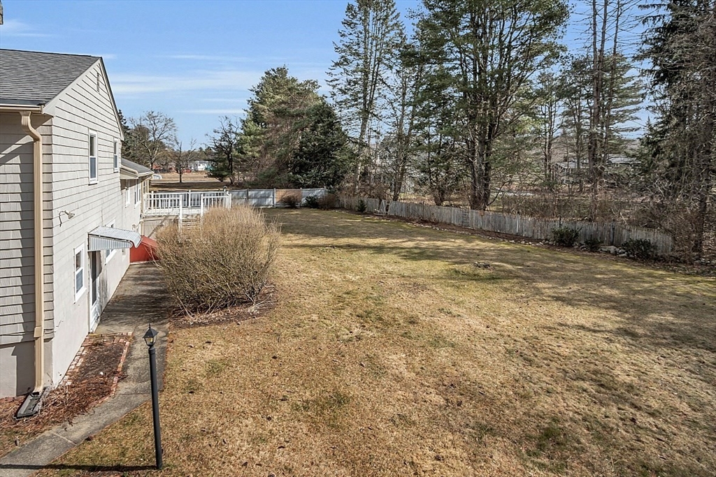 29 Meriam Road Concord, MA 01742 - Photo 5 of 24 a view of a yard with wooden fence