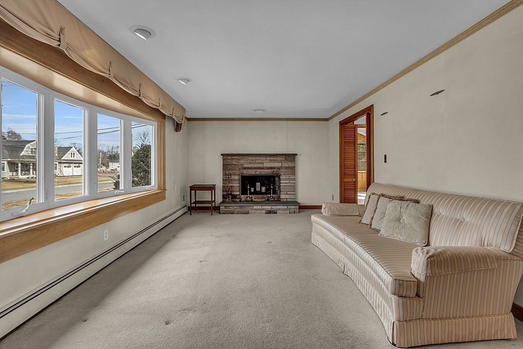 29 Meriam Road Concord, MA 01742 - Photo 10 of 24 a living room with furniture and a fireplace