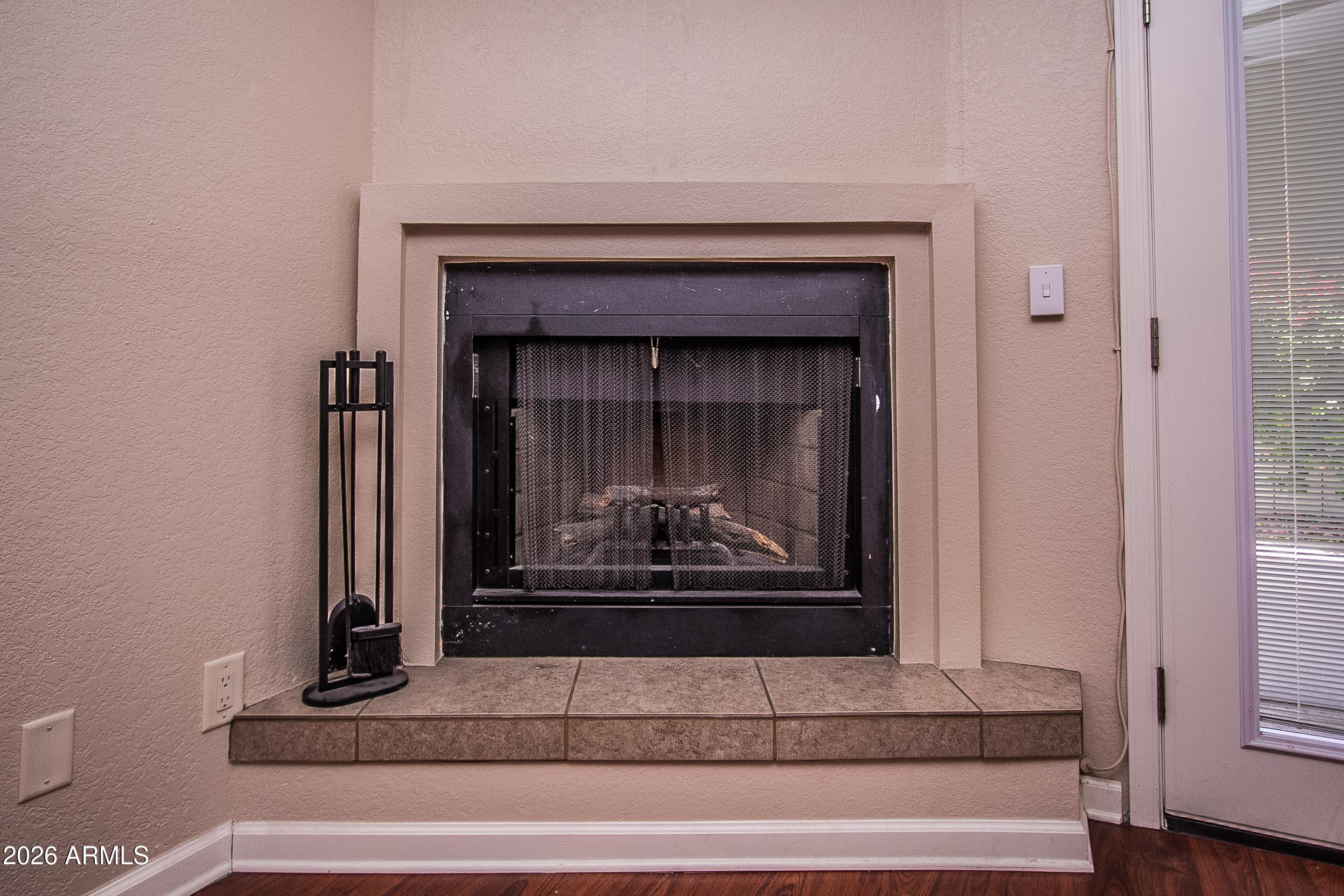 7755 East Thomas Road, Unit 18 Scottsdale, AZ 85251 - Photo 5 of 26 Wood burning fireplace