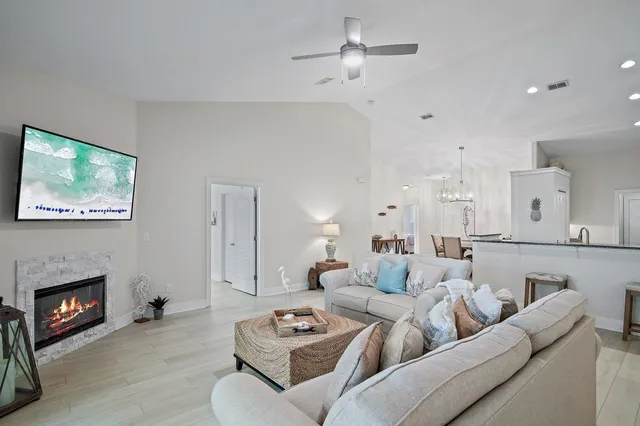 a living room with furniture a fireplace and a fireplace