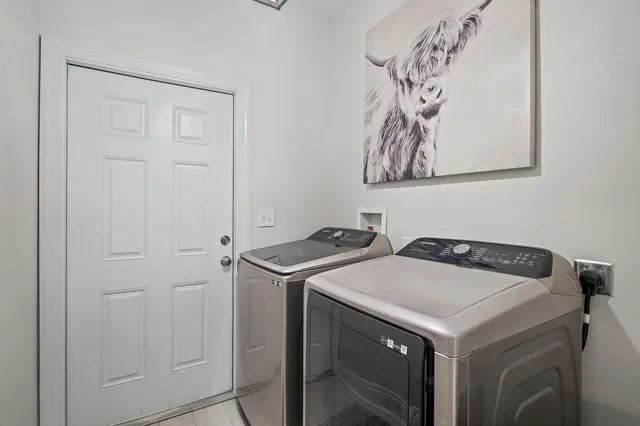 a utility room with dryer and washer