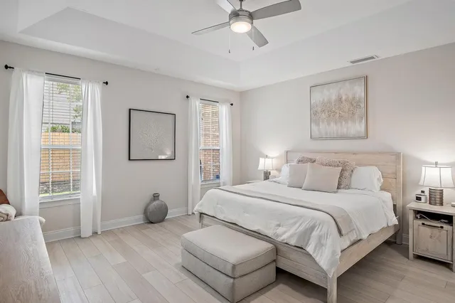 a bedroom with a large bed and a window