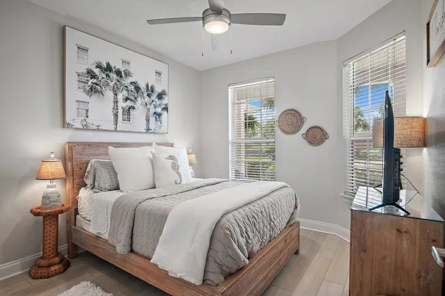 a bedroom with a large bed and a window