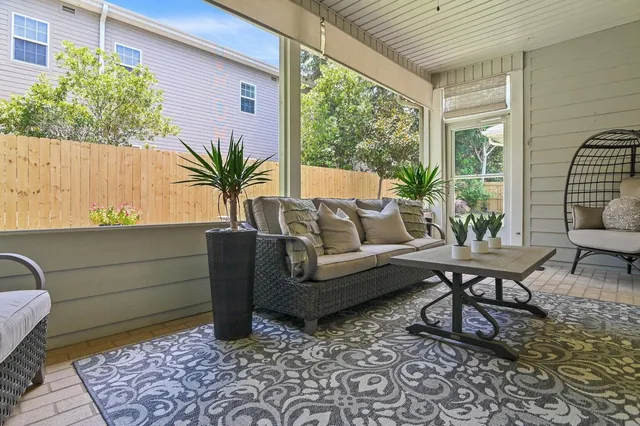 a outdoor living space with furniture and a potted plant
