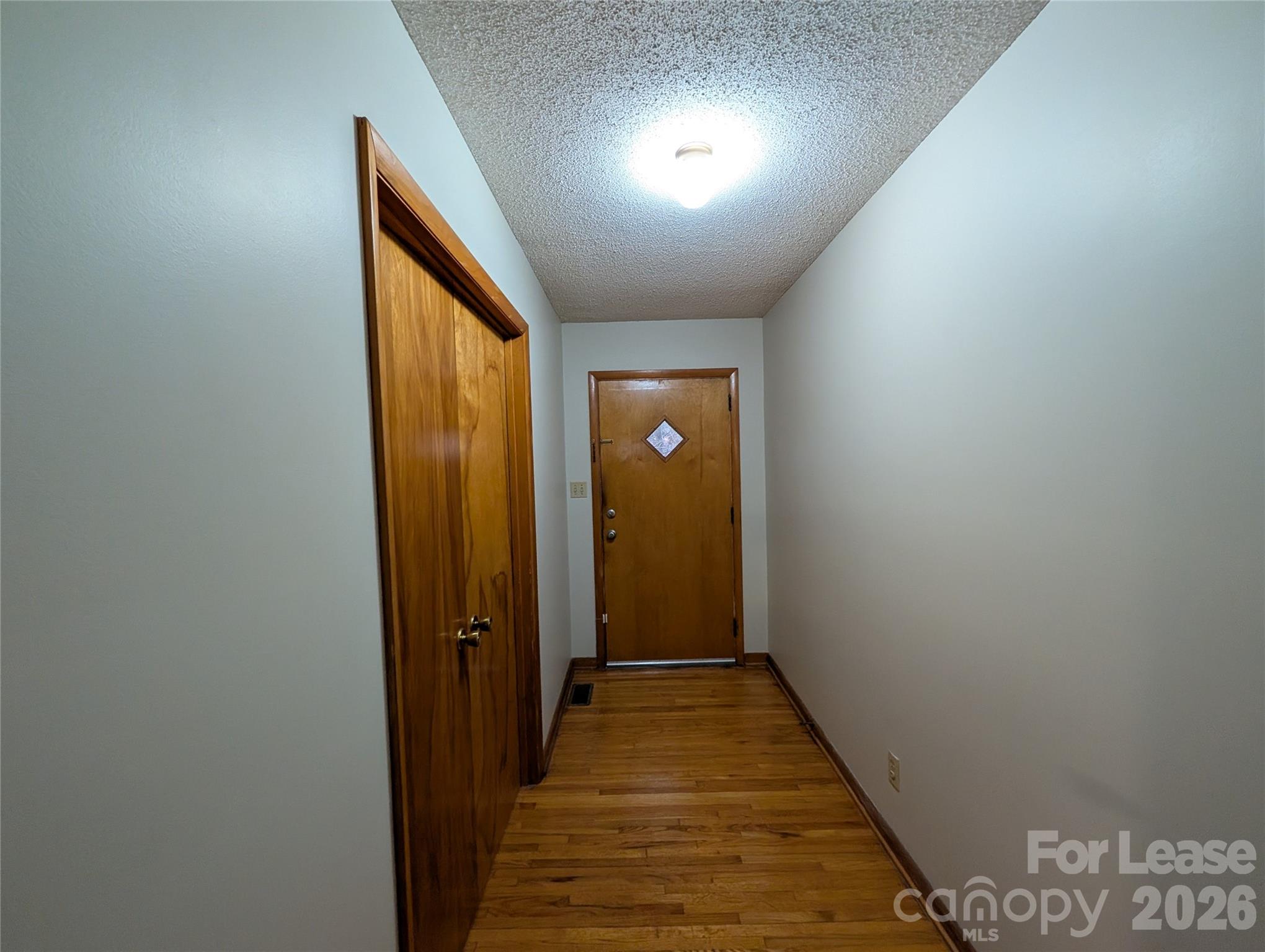 805 Edgewood Road Bessemer City, NC 28016 - Photo 2 of 19 a view of a hallway with wooden floor