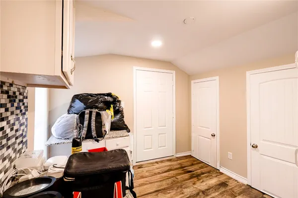a bedroom with a bed and cabinets