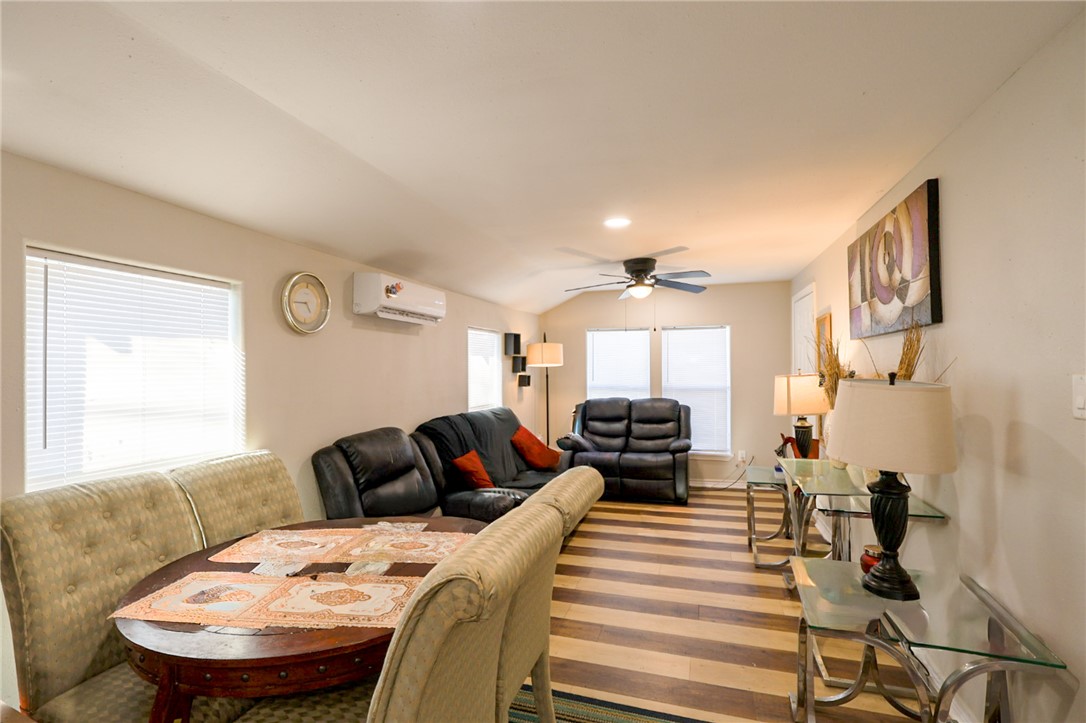 1211 West 18th Street Bryan, TX 77803 - Photo 5 of 12 a bedroom with a bed and wooden floor