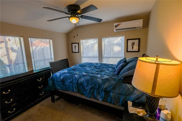 a bed room with a bed and a window