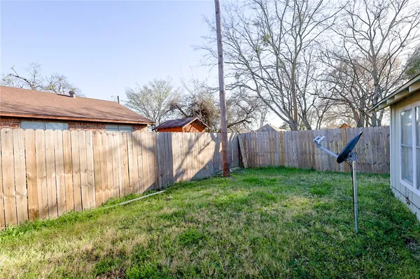 a view of backyard with green space