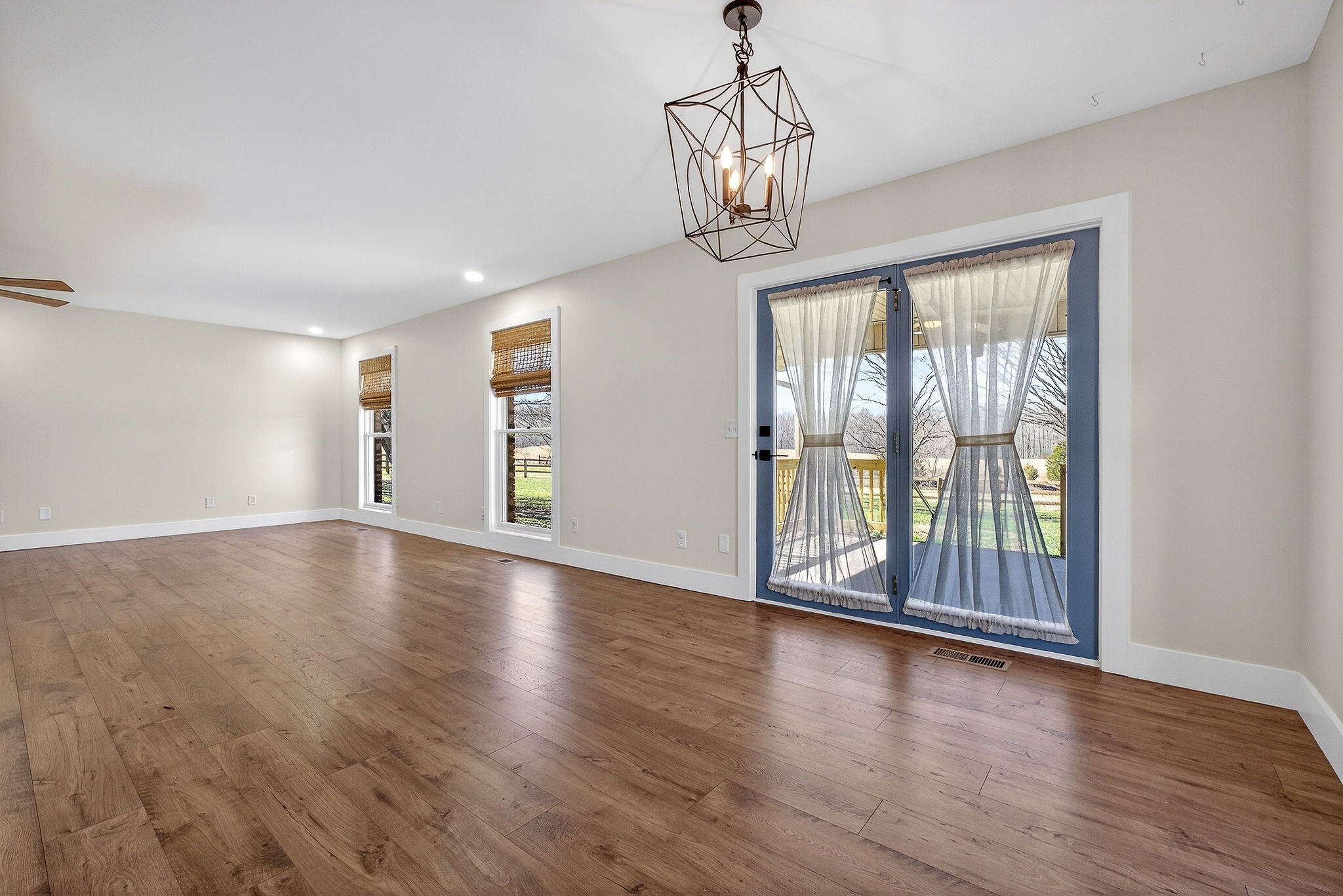 3857 Baxter Road Baxter, TN 38544 - Photo 11 of 52 a view of an empty room with wooden floor and a window