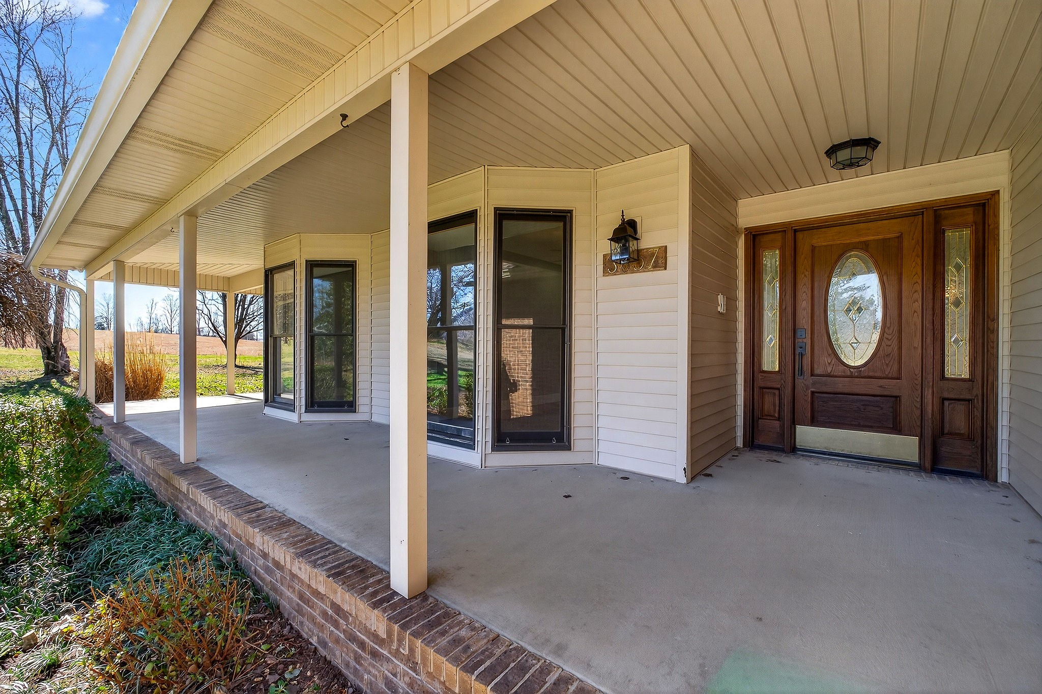 3857 Baxter Road Baxter, TN 38544 - Photo 2 of 52 a view of a hallway with wooden walls and windows