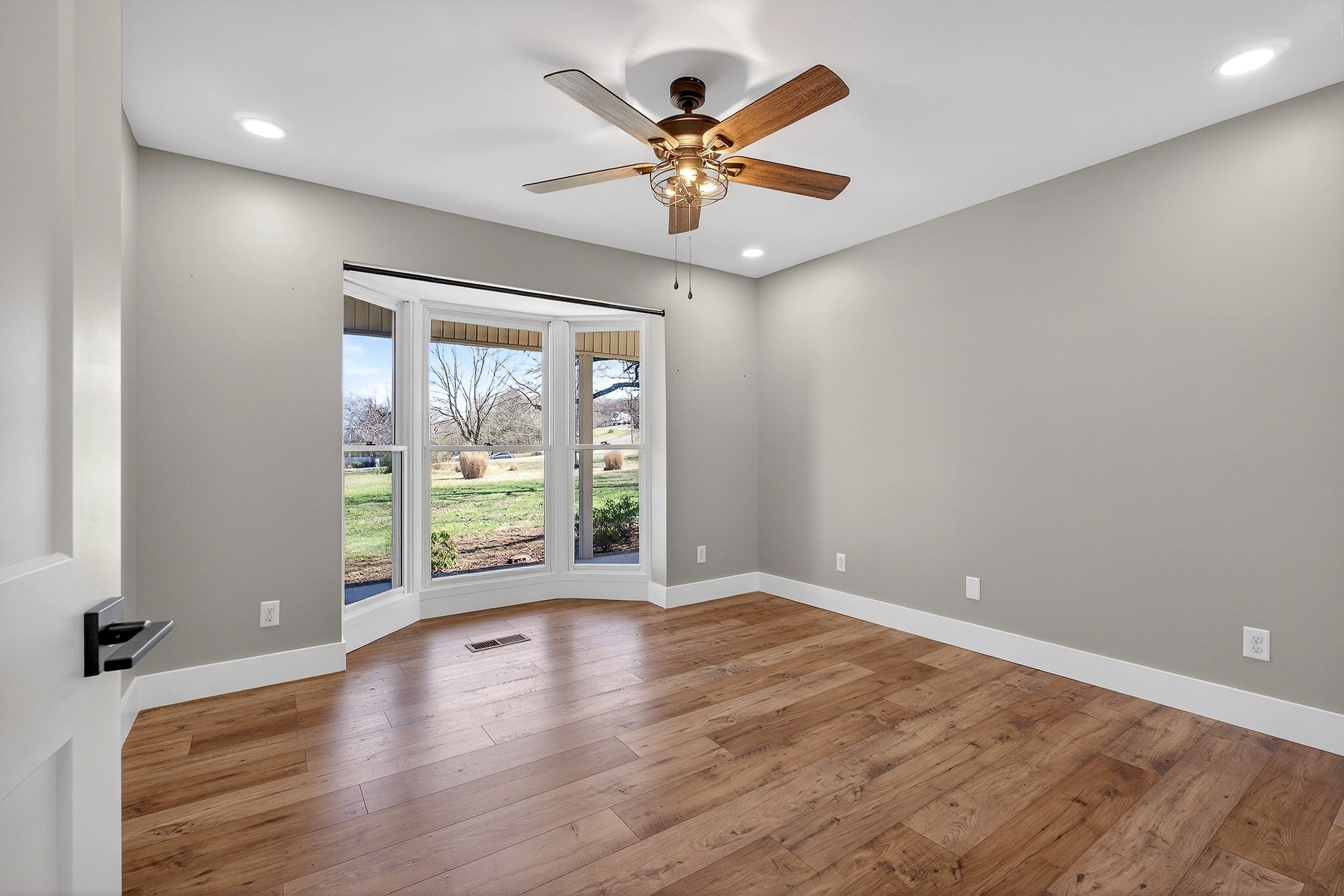 3857 Baxter Road Baxter, TN 38544 - Photo 24 of 52 a view of an empty room with wooden floor and a window