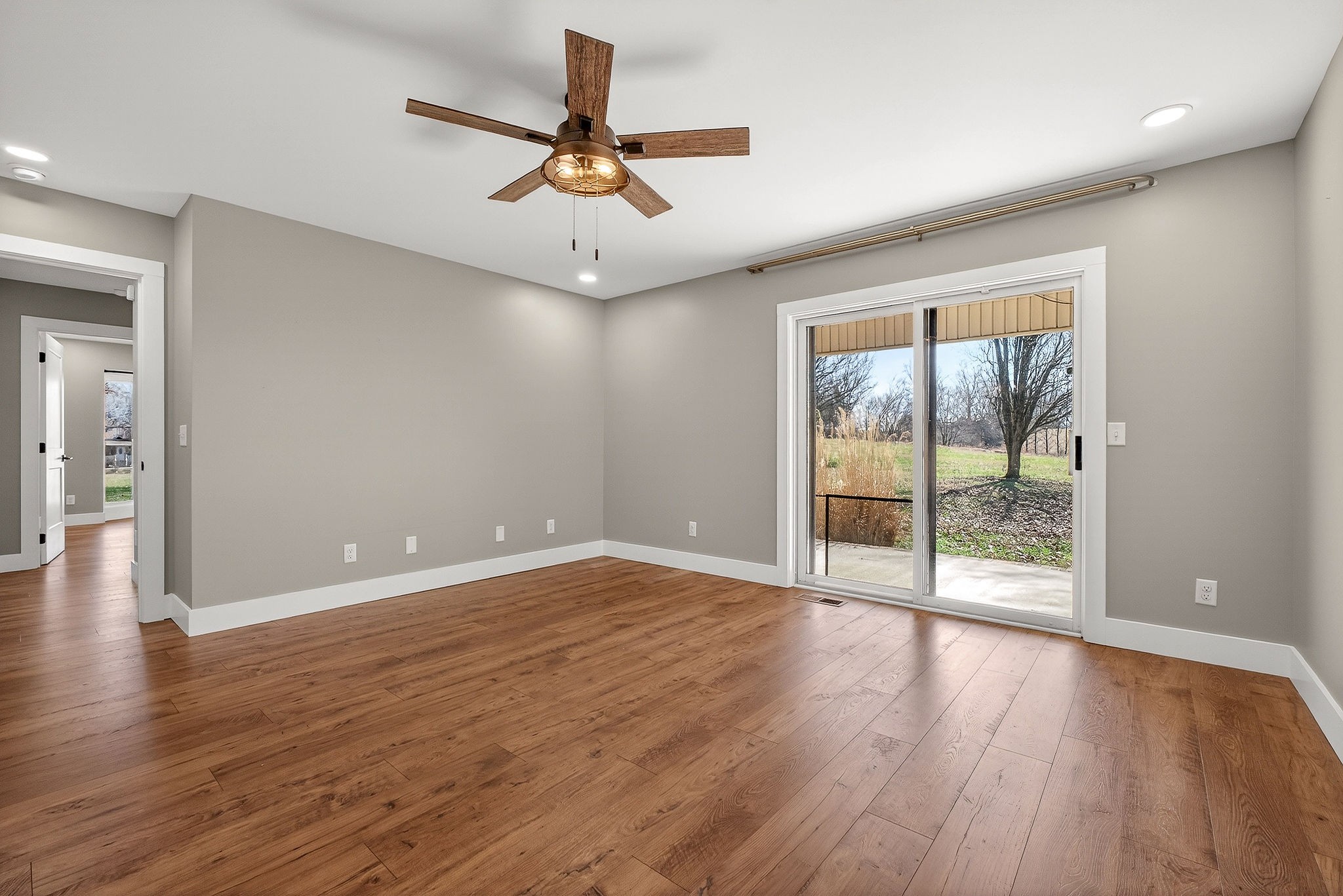 3857 Baxter Road Baxter, TN 38544 - Photo 28 of 52 a view of an empty room with wooden floor and a window