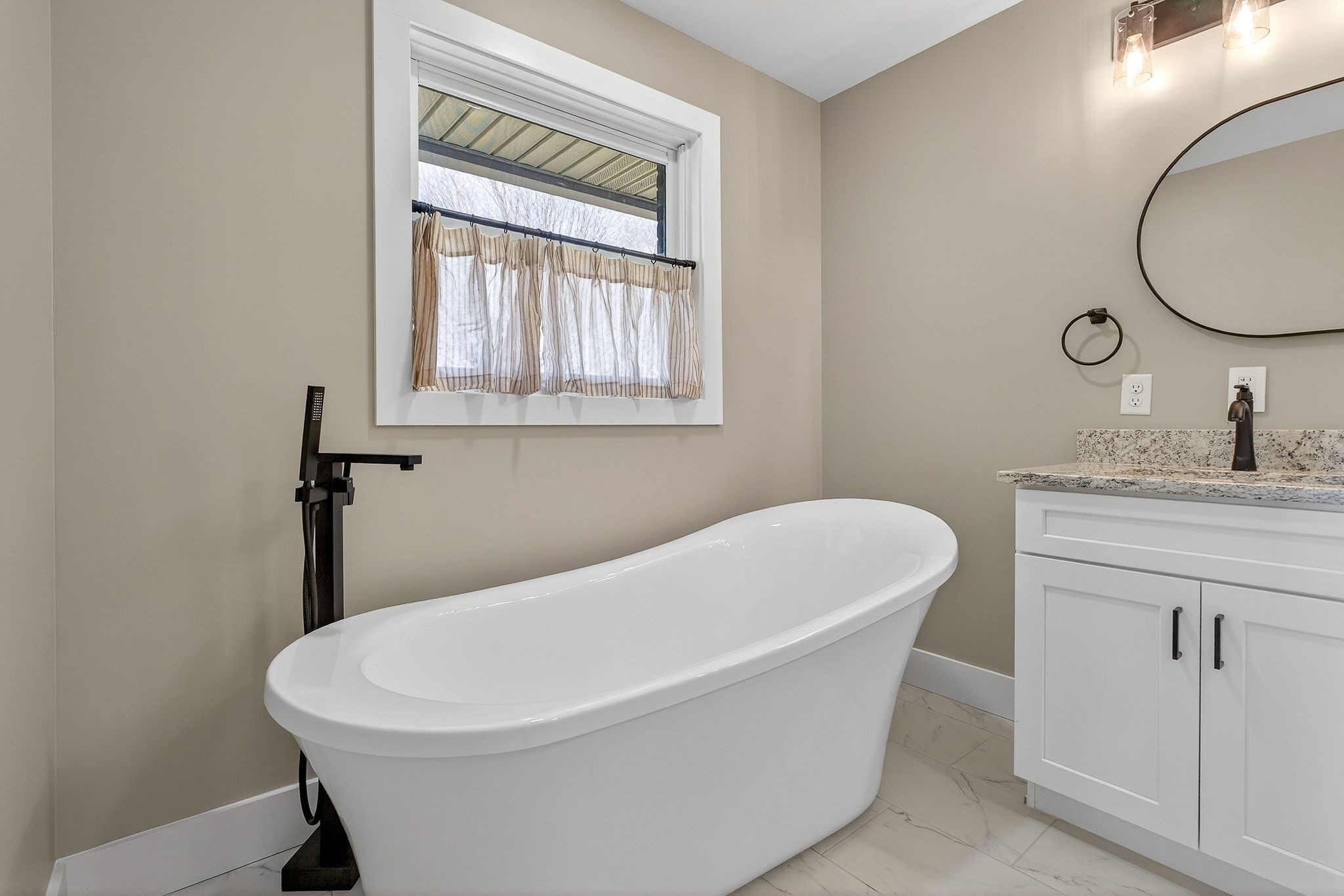 3857 Baxter Road Baxter, TN 38544 - Photo 31 of 52 a white bath tub sitting next to a white sink