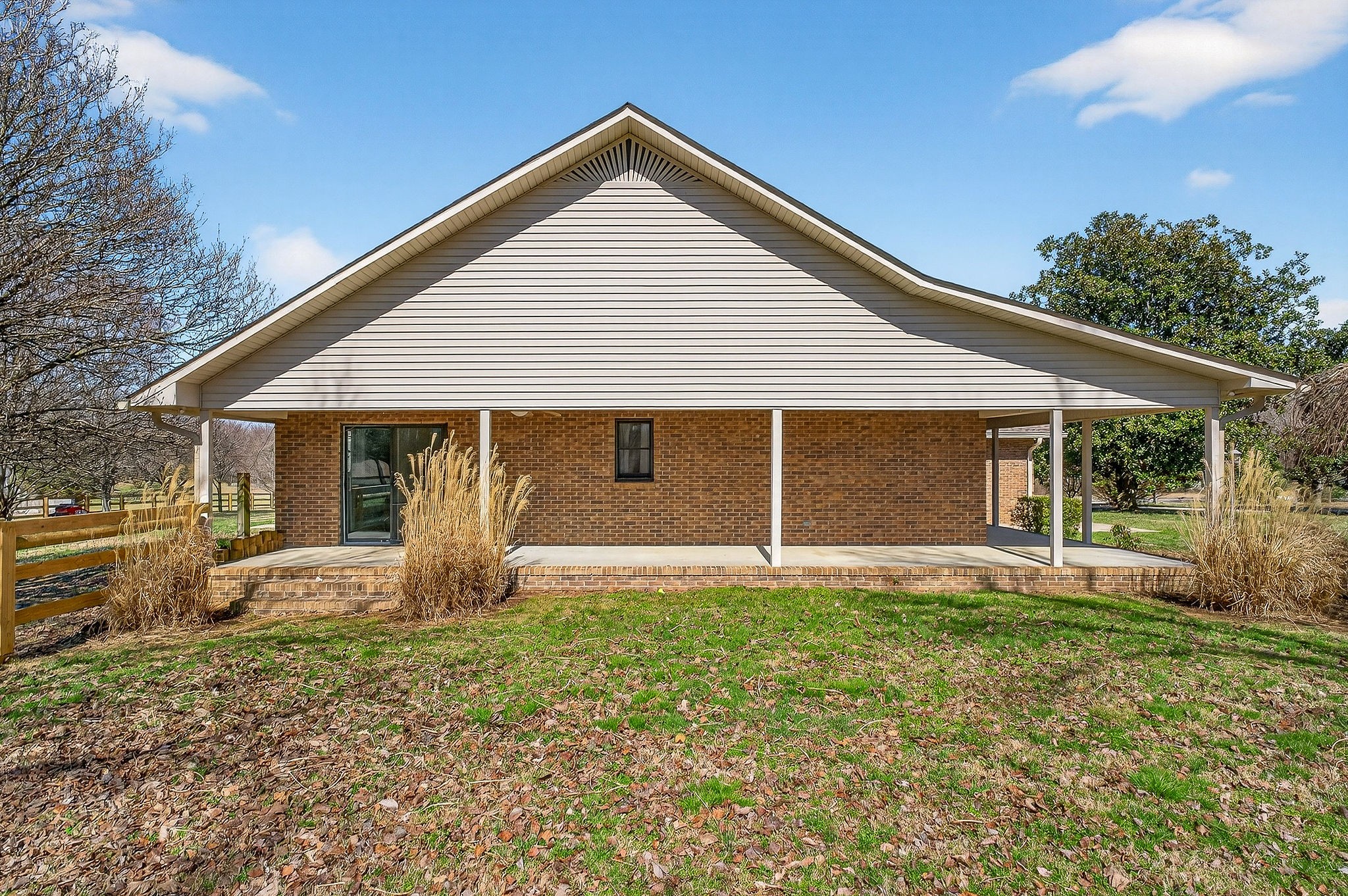 3857 Baxter Road Baxter, TN 38544 - Photo 46 of 52 a front view of a house with yard and porch