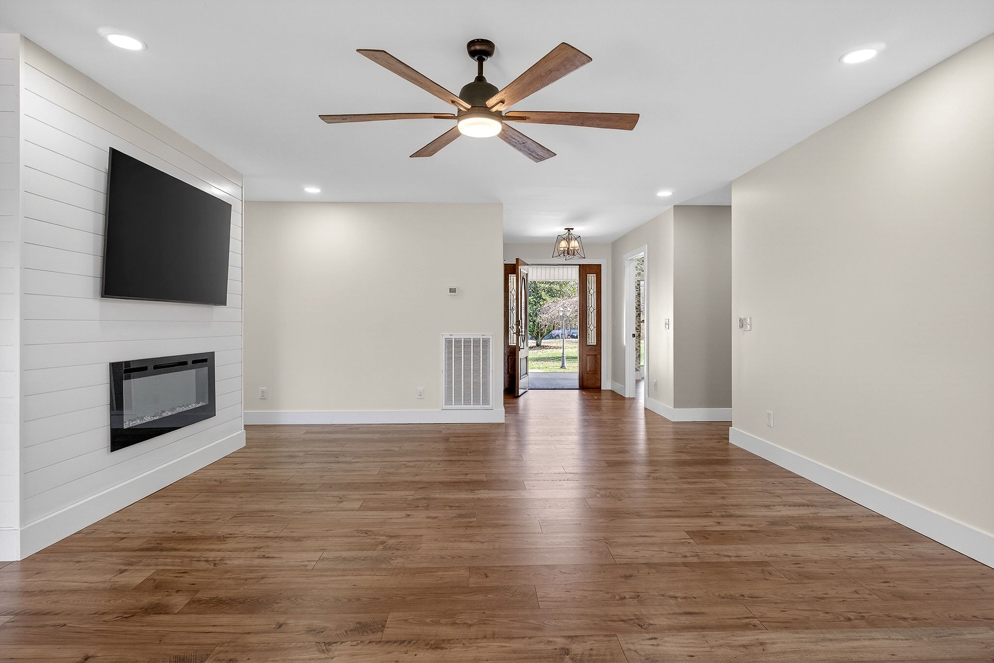 3857 Baxter Road Baxter, TN 38544 - Photo 7 of 52 a view of an empty room with wooden floor and a fireplace