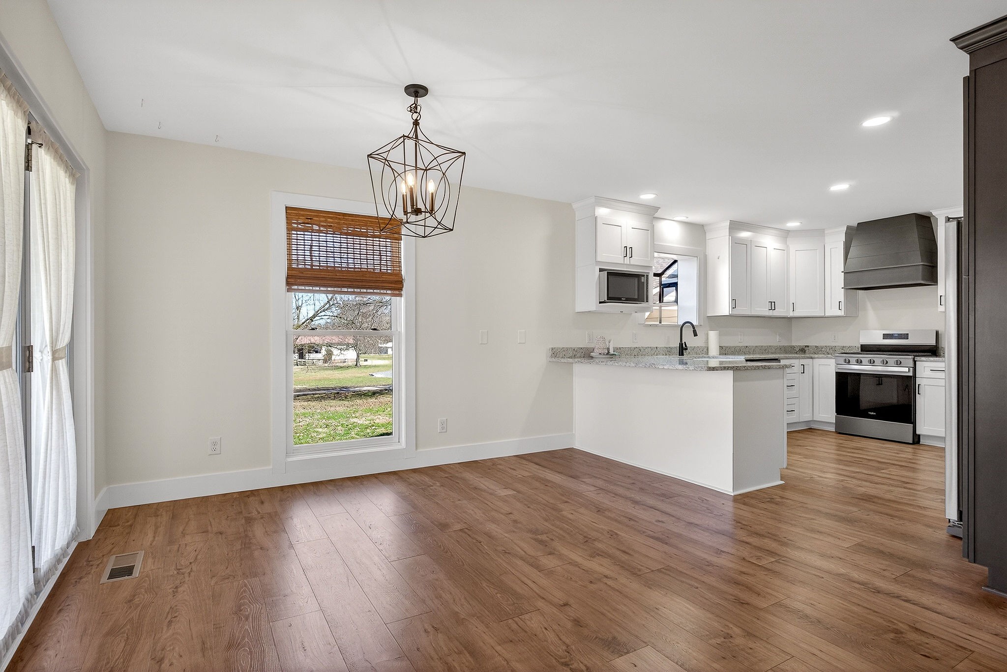 3857 Baxter Road Baxter, TN 38544 - Photo 10 of 52 a view of a kitchen with a sink wooden floor and a window