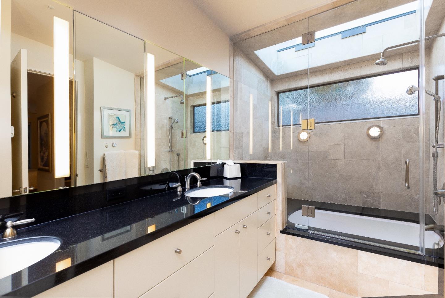 0 Scenic Road Carmel, CA 93923 - Photo 12 of 21 a bathroom with a granite countertop sink a mirror and a shower