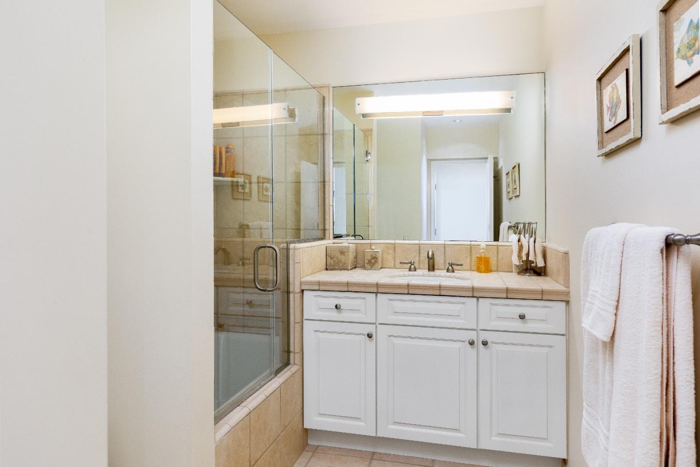 0 Scenic Road Carmel, CA 93923 - Photo 15 of 21 a bathroom with a double vanity sink and mirror