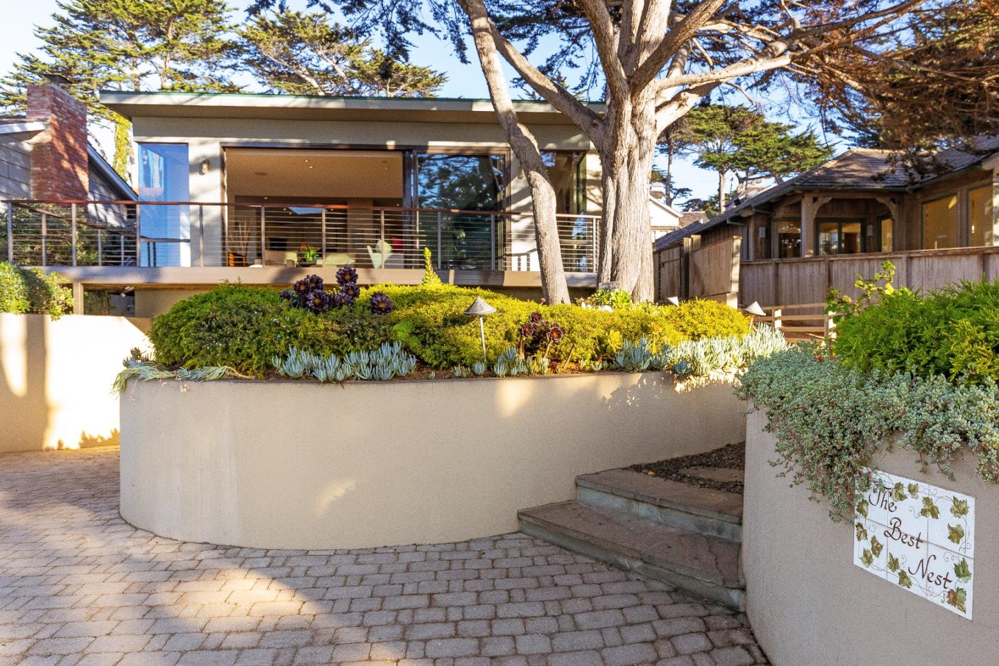 0 Scenic Road Carmel, CA 93923 - Photo 2 of 21 a view of a house with a yard and potted plants