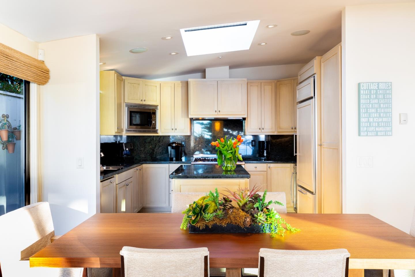 0 Scenic Road Carmel, CA 93923 - Photo 8 of 21 a kitchen with stainless steel appliances granite countertop a refrigerator a stove a sink dishwasher and white cabinets with wooden floor