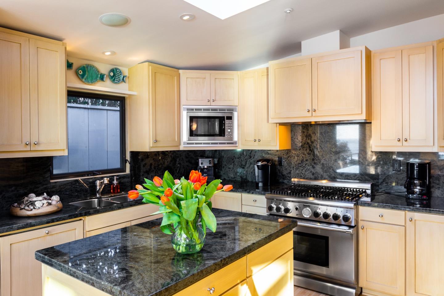 0 Scenic Road Carmel, CA 93923 - Photo 9 of 21 a kitchen with stainless steel appliances granite countertop a stove a sink and a microwave