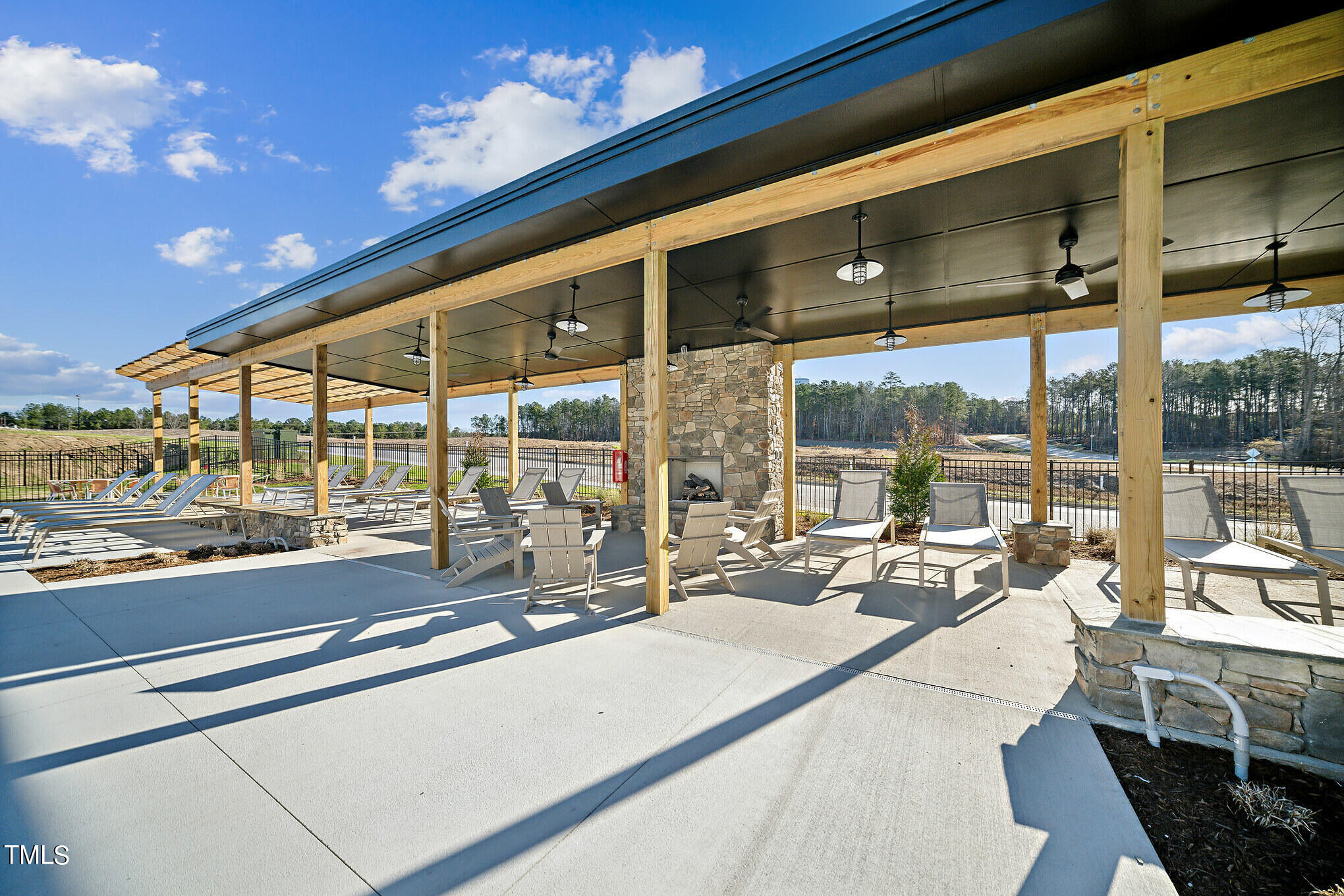 1318 Hazelnut Ridge Lane Knightdale, NC 27545 - Photo 34 of 38 SR pool deck and fireplace