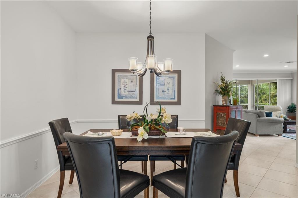 23164 Grassy Pine Drive Estero, FL 33928 - Photo 15 of 43 a dining room with furniture and window