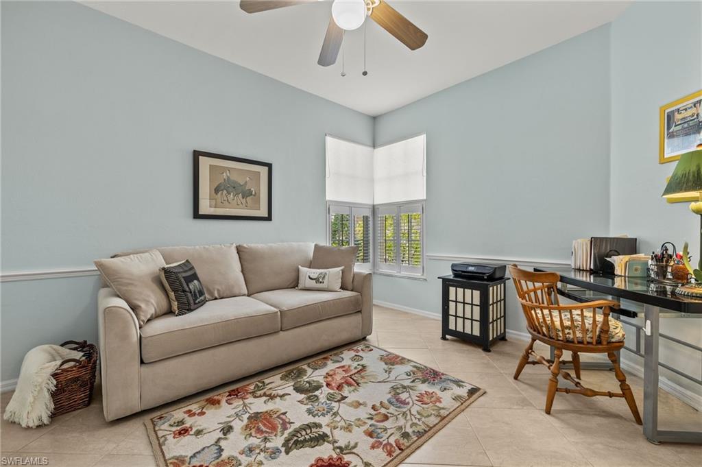 23164 Grassy Pine Drive Estero, FL 33928 - Photo 16 of 43 a living room with furniture and a rug