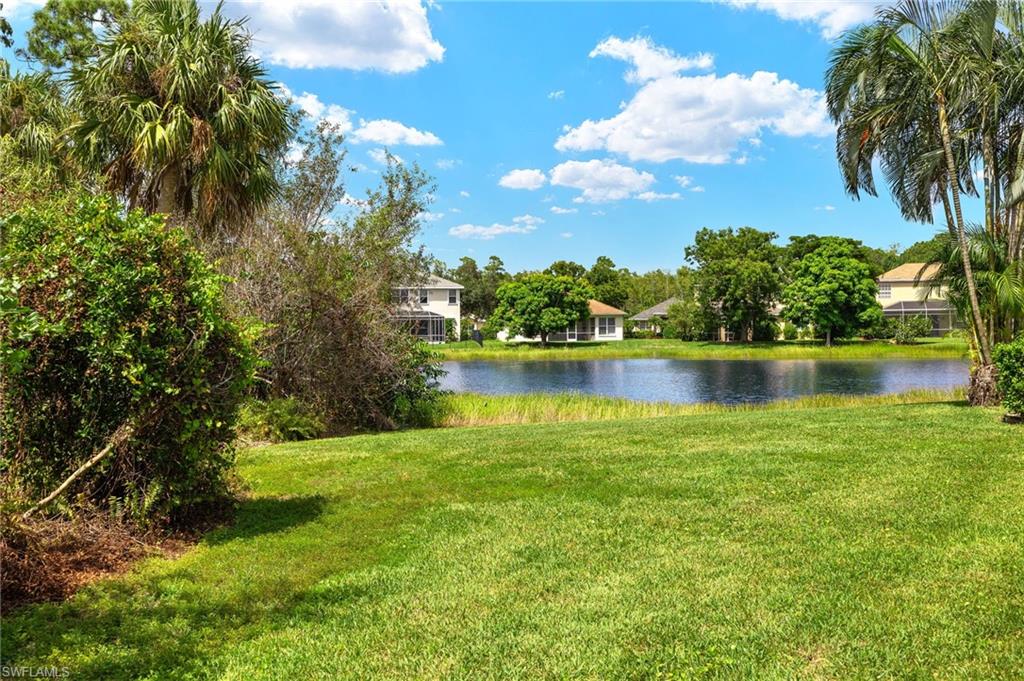 23164 Grassy Pine Drive Estero, FL 33928 - Photo 27 of 43 a view of a lake with houses in the back