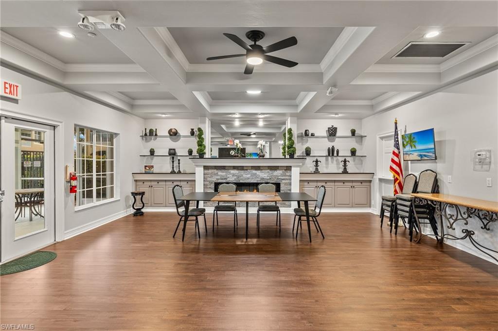 23164 Grassy Pine Drive Estero, FL 33928 - Photo 32 of 43 a view of a dining room with furniture and wooden floor