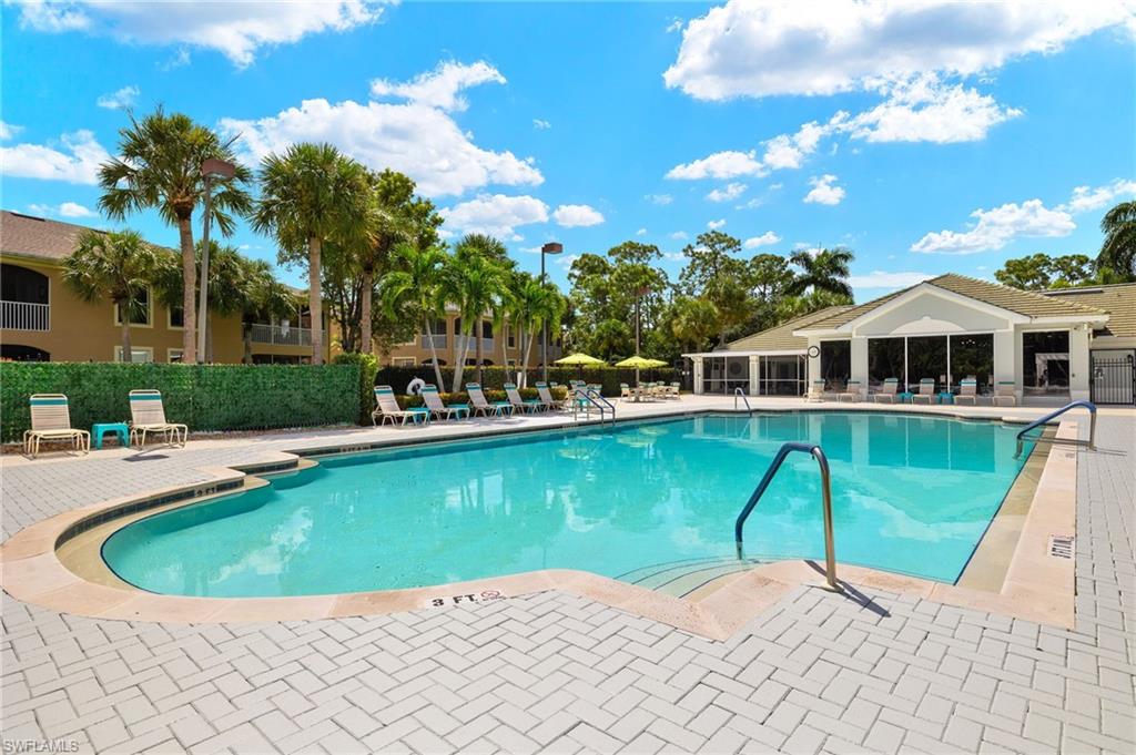 23164 Grassy Pine Drive Estero, FL 33928 - Photo 35 of 43 a view of a house with swimming pool and sitting area